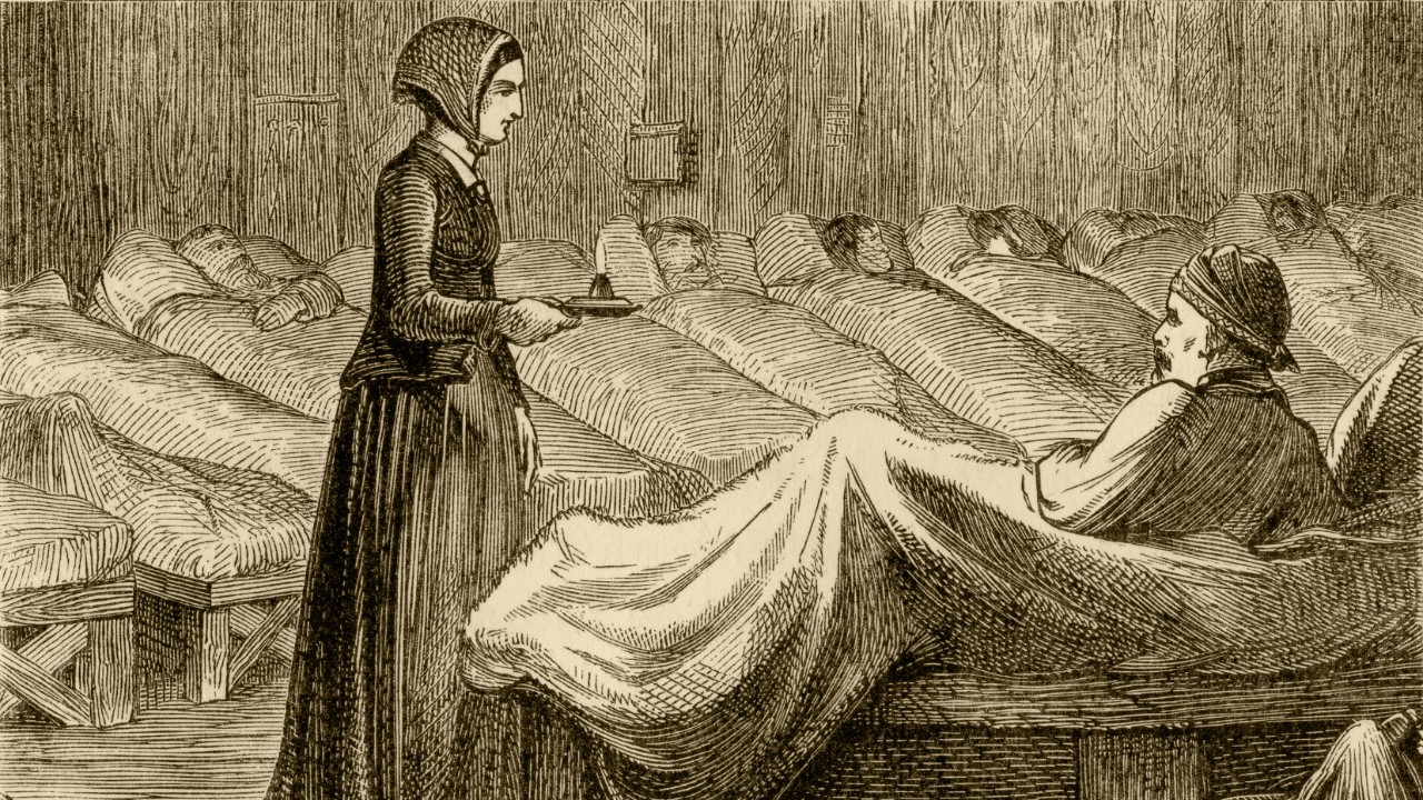Florence Nightingale working at Scutari military hospital in the Crimea, during the Crimean War (1853-56). From “Aunt Charlotte’s Stories of English History for the Little Ones” by Charlotte M Yonge. Published by Marcus Ward & Co, London & Belfast, in 1884.